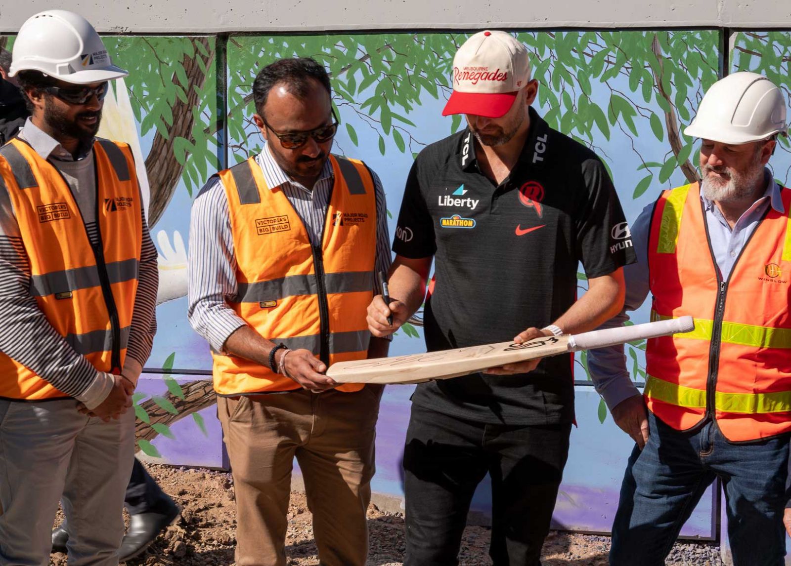 Australian test legend Nathan Lyon with project team members.