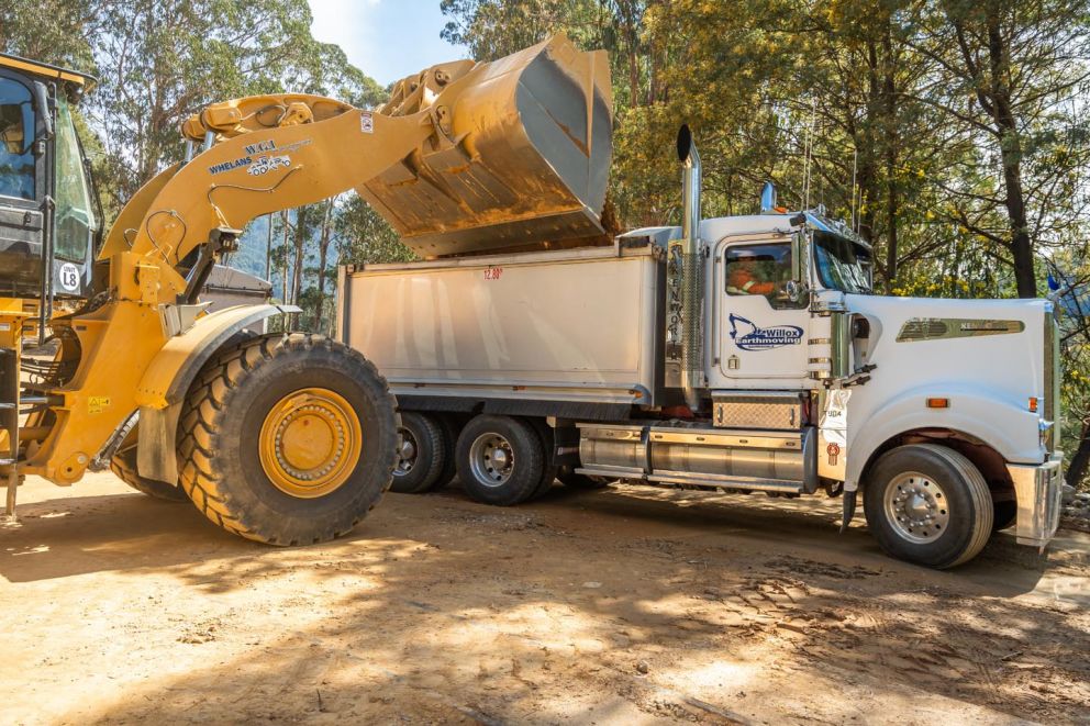 Material being loaded into an awaiting truck
