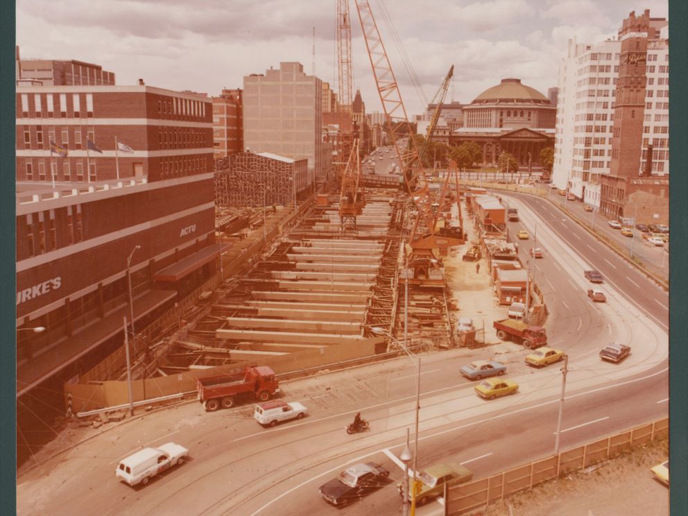 Cars on roadway over Museum station while under construction.