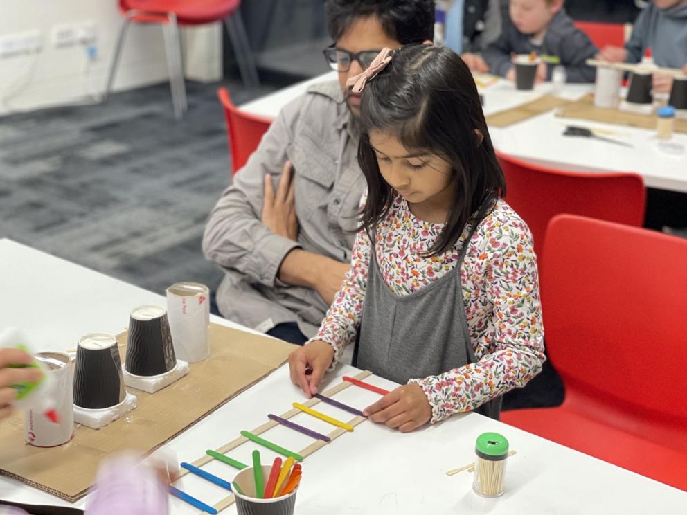 Building bridges with local school students.