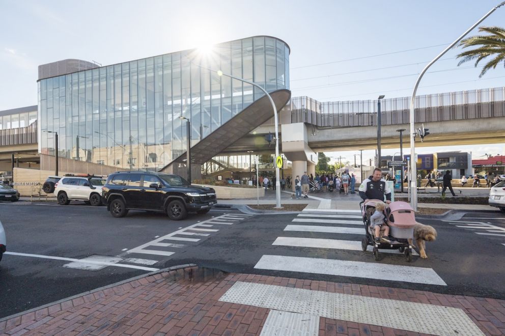 Sun shines on the new Parkdale Station with the new open space connecting the community