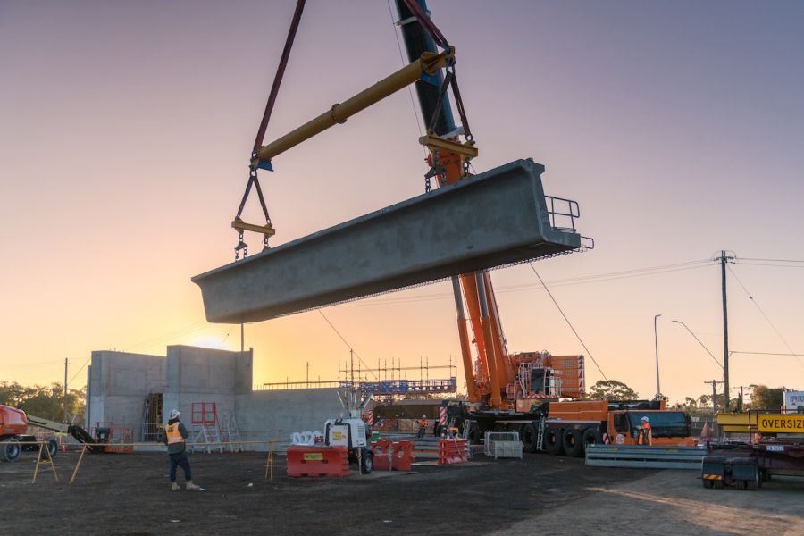 Spotters watch as the first beam is lifted into place at Melton