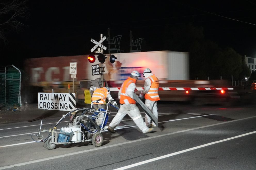 Workers line marking at the Maidstone Street level crossing