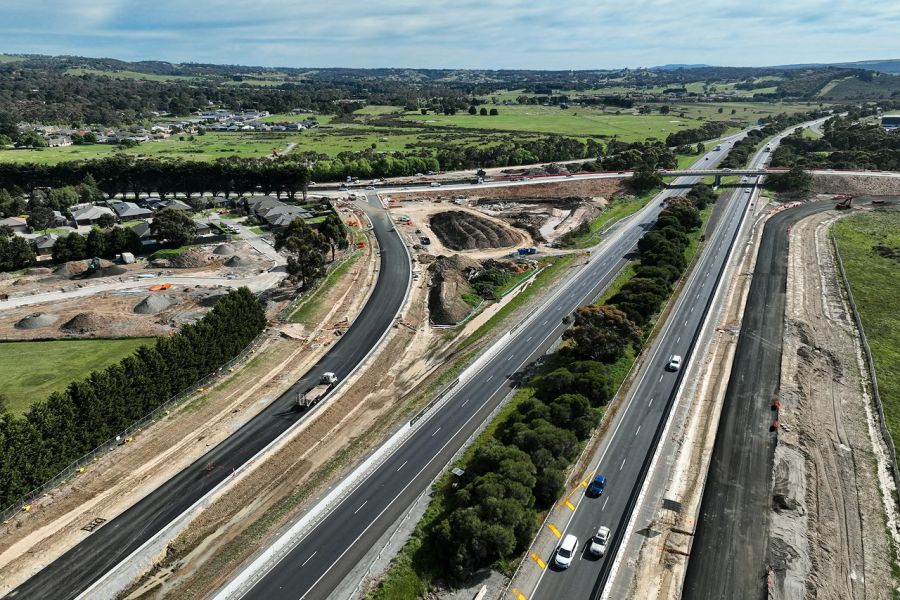 Aerial view of the Watson Street Interchange Upgrade showing construction of new south-facing freeway entry and exit ramps beside the Hume Freeway.