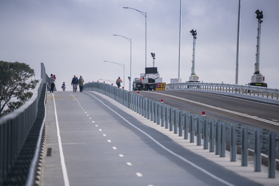 New Evans Road bridge with people walking along the pedestrian lane