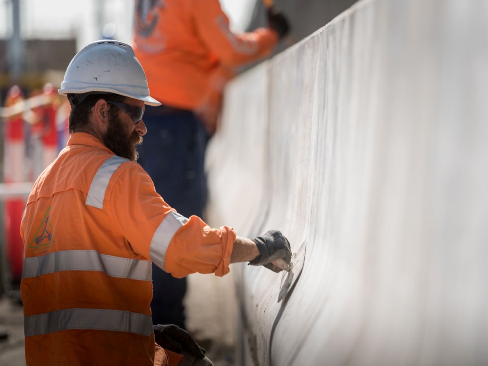 Photo of crew working on new concrete barriers at Grieve Parade