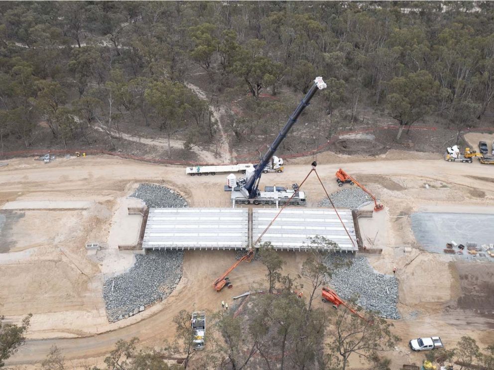 The last of the 125 concrete Super – Tee beams installed on the Victorian flood relief bridge 