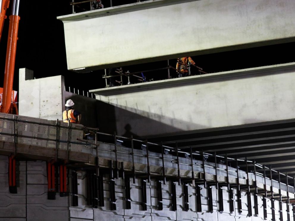 Lifting the beams into place for the bridge over Centre Dandenong Road.