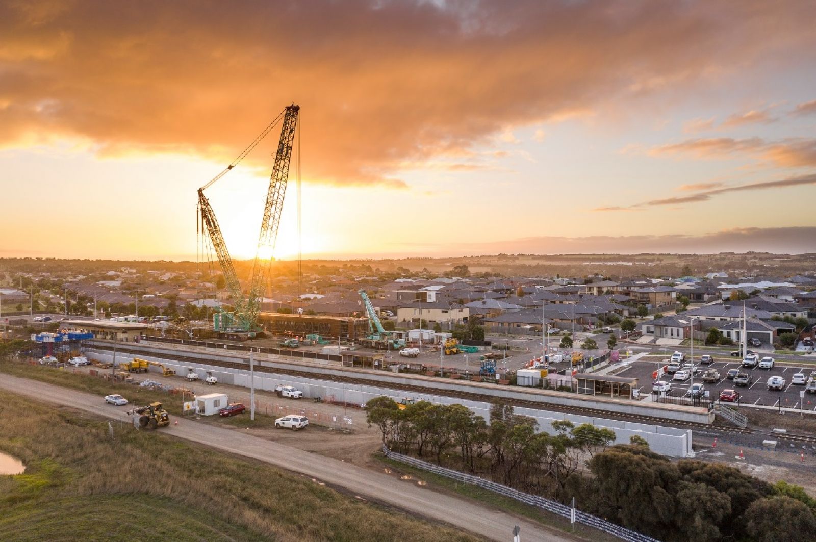 Crane lifting pedestrian overpass into place at Waurn Ponds Station