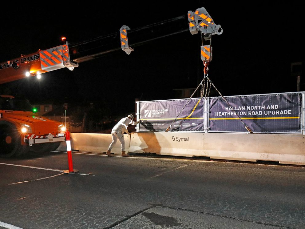 Safety barrier being lifted into place