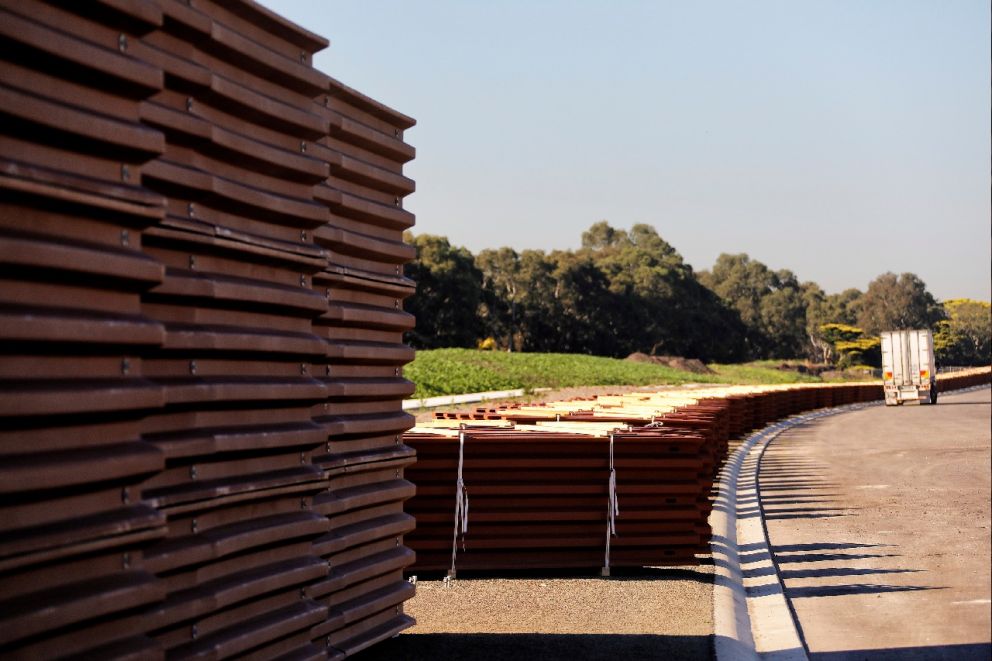 Works to install the 75% recycled plastic noise walls along the Freeway