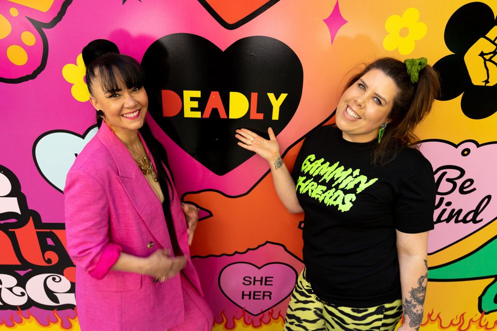 Kristy Dickinson and Tahnee Edwards posing in front of text reading deadly in black love heart.