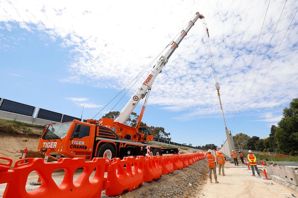 Crane placing retaining wall panels