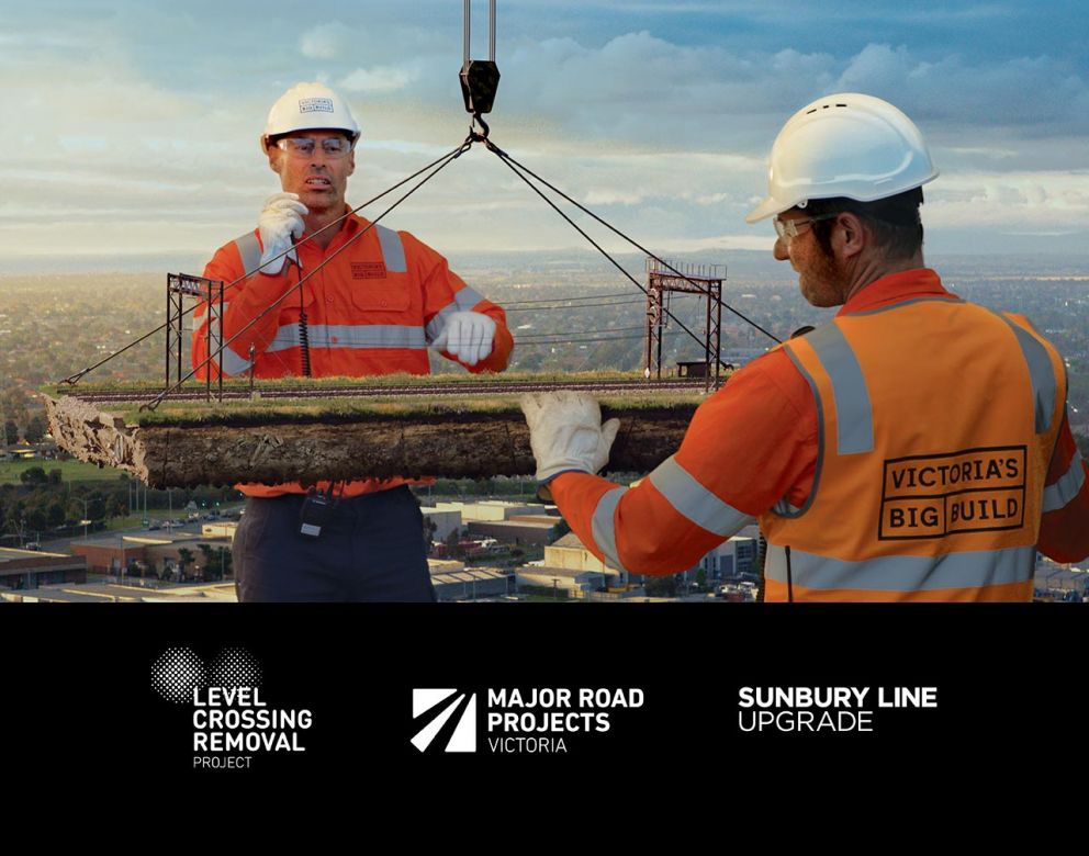 Two giant construction workers working on a rail line. The Level Crosing Removal, Major Road Projects Victoria and Sunbury Line Upgrade logos are under the giants.