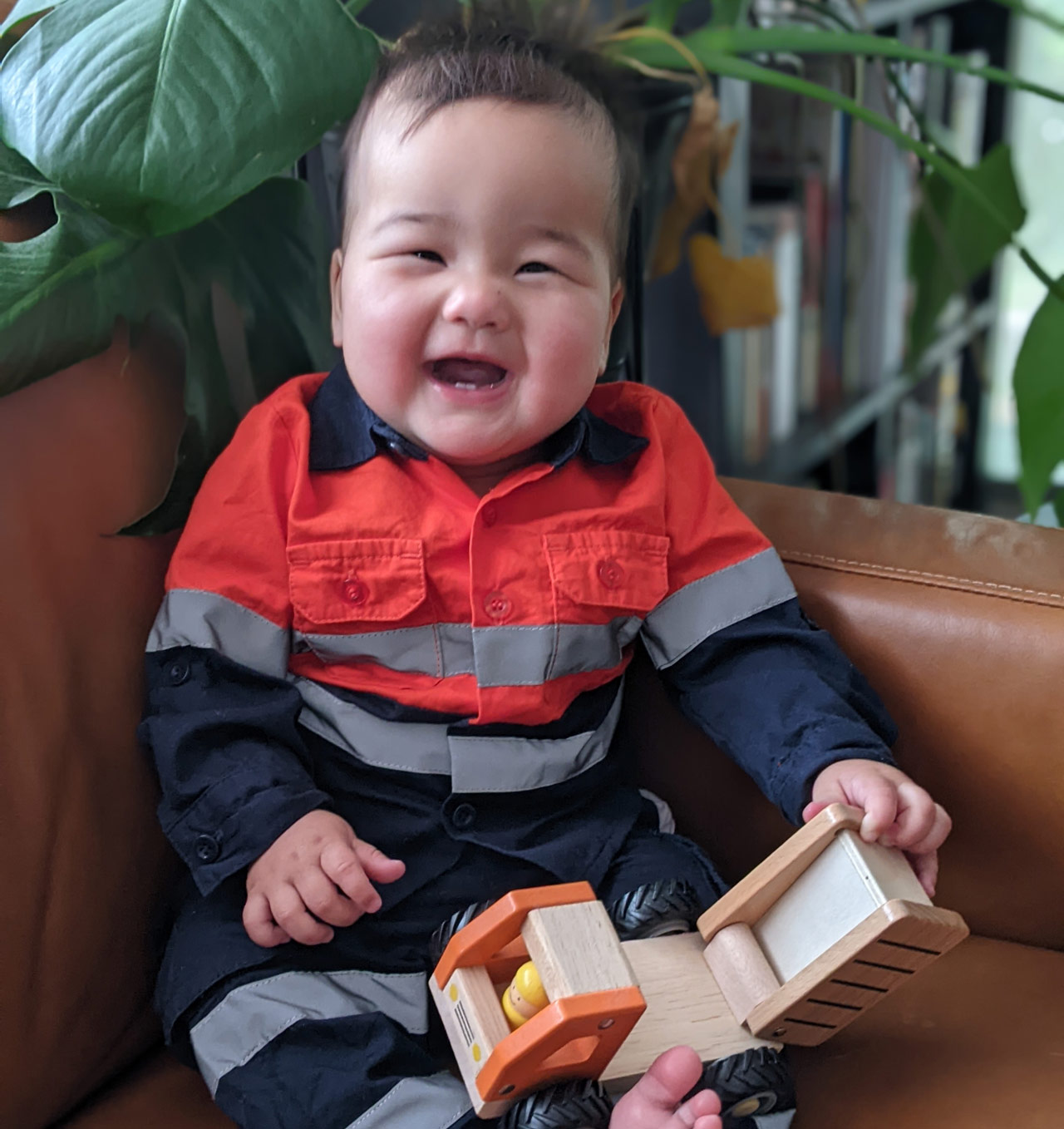 Sylvia's baby daughter Zoe pictured in her very own construction uniform.