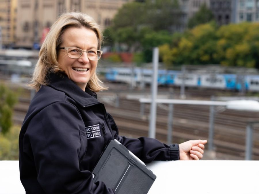 Amanda Benson with a rail yard in the background