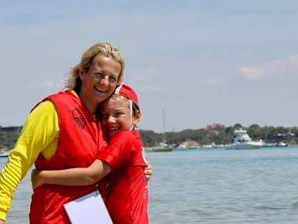Amanda Benson surf lifesaving with her son