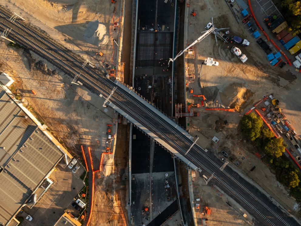 Aerial view of the completed rail track over the road underpass.