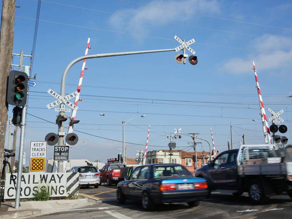Cars travelling over North Road level crossing