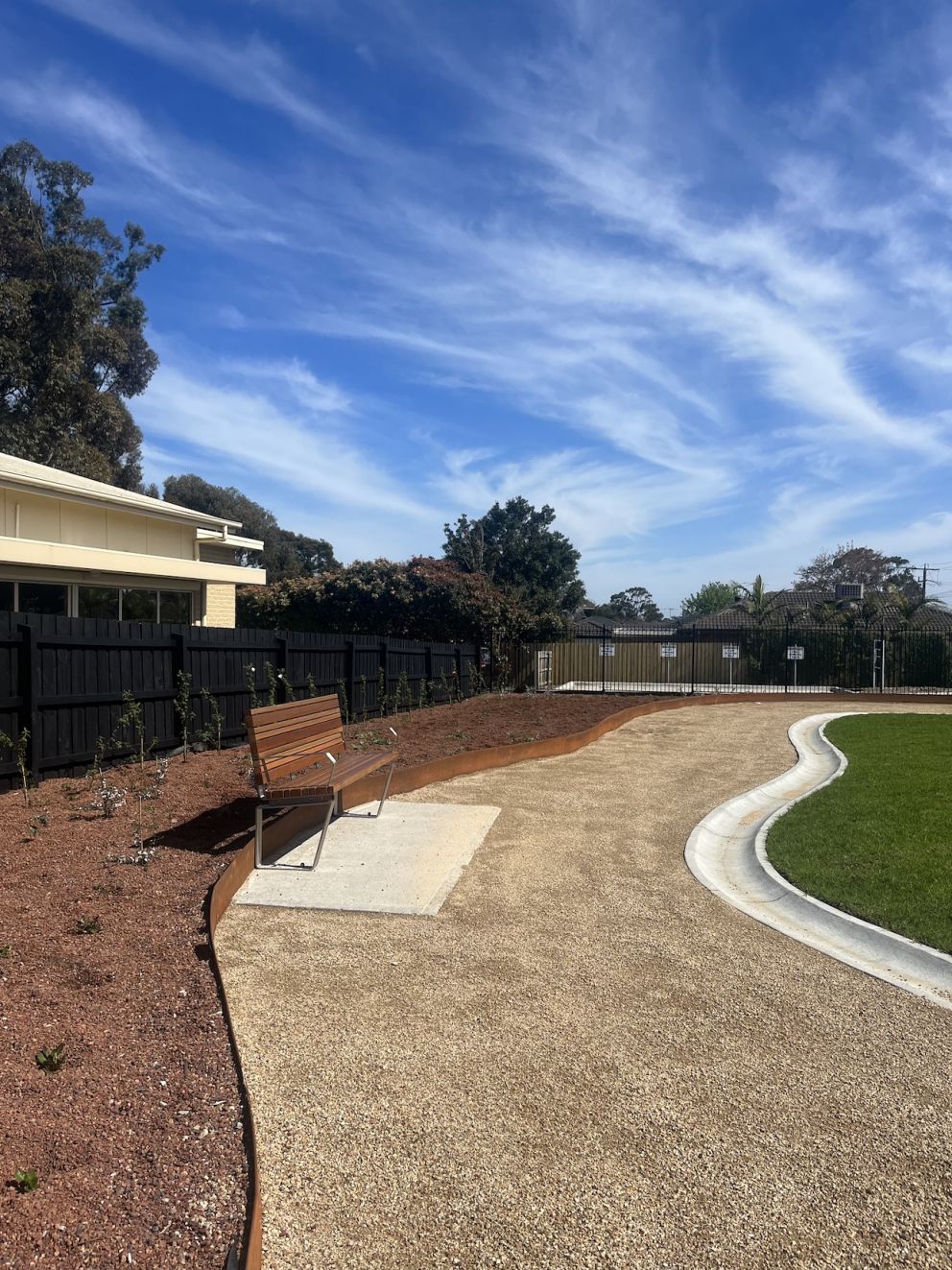 Pocket park path, garden bed and seat for the community to enjoy