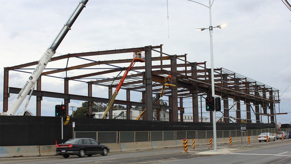 Steel framing for a large shed that's being erected at North East Link's Watsonia site.