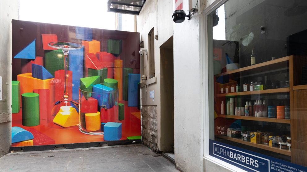 Wide angle image of Shelley Horan's colourful artwork in Scott Alley