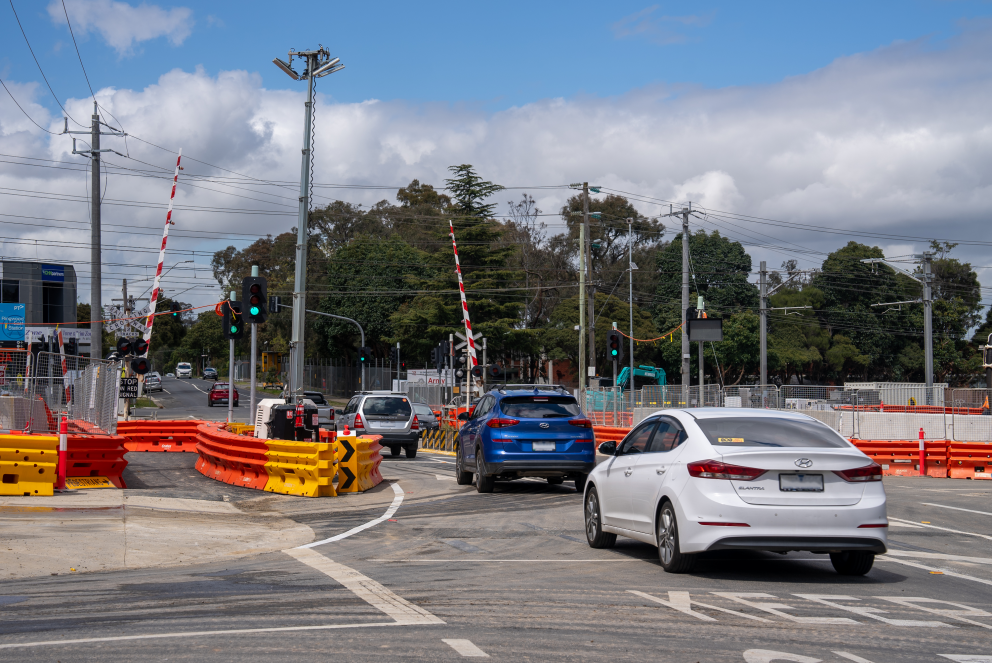Cars driving through the reopened Dublin Road level crossing