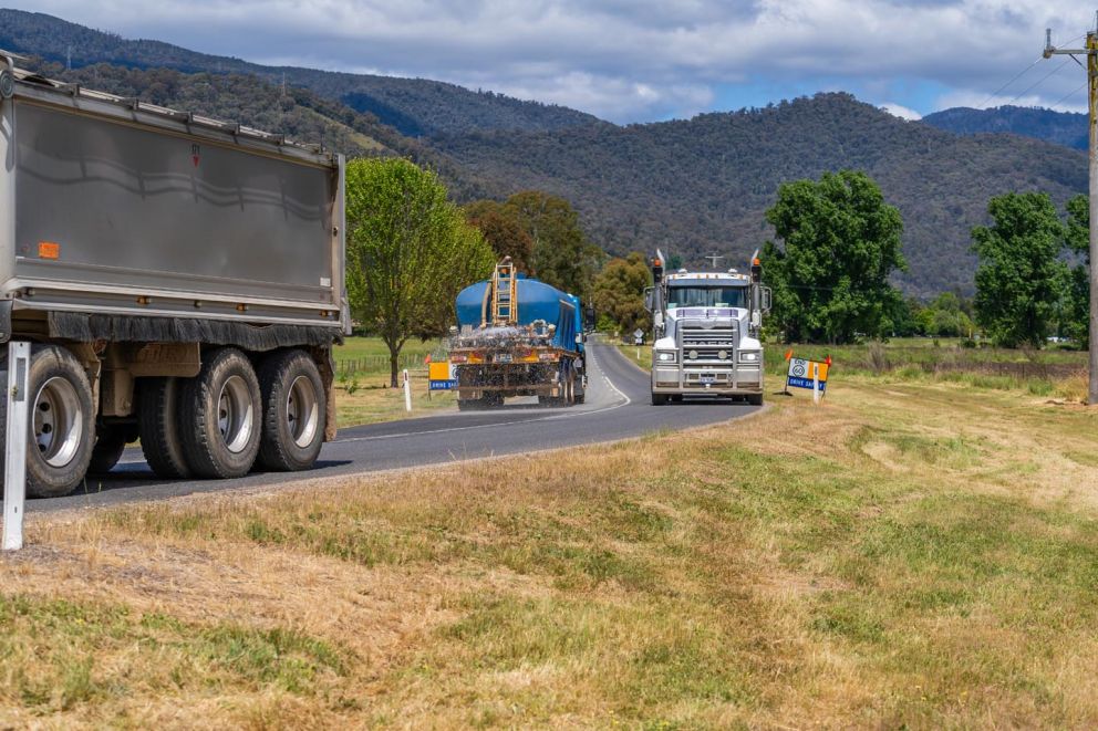 Trucks travelling along Wermatong Pit haulage route