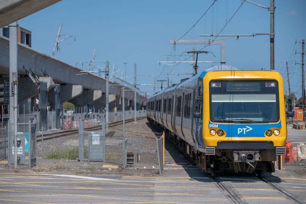 A train on the Mernda line passes over Keon Parade