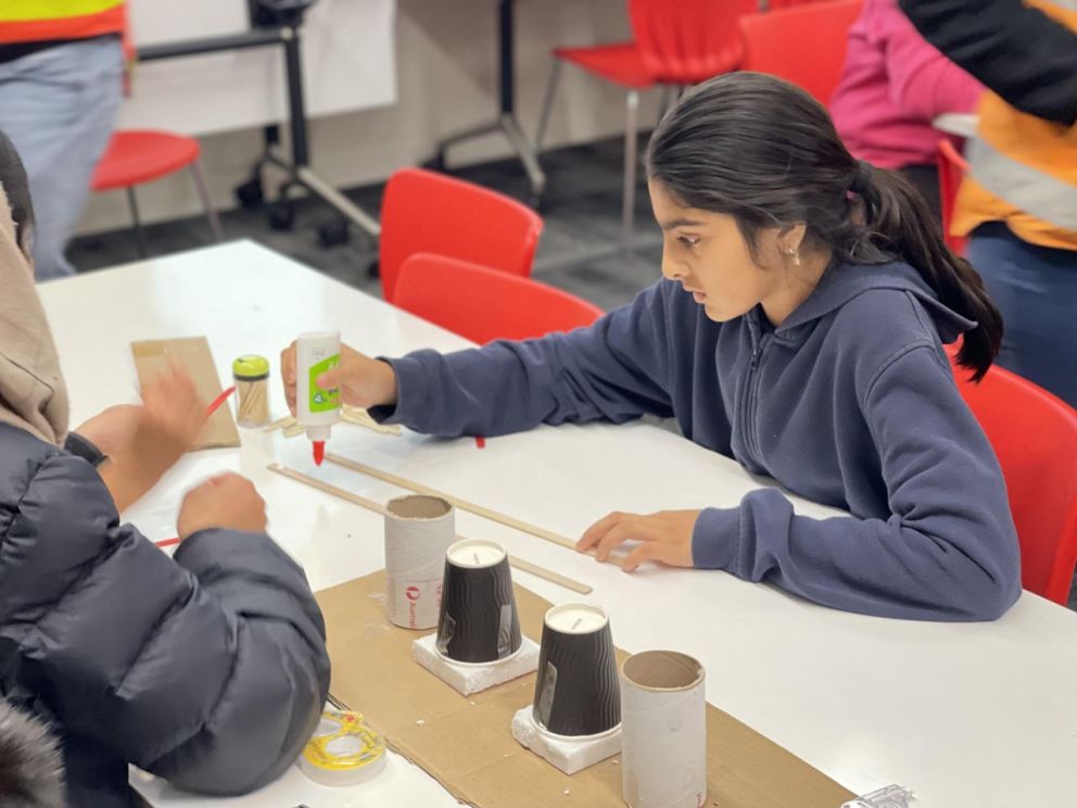 Building bridges with local school students.