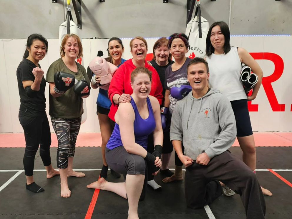 Group of women with owner smiling