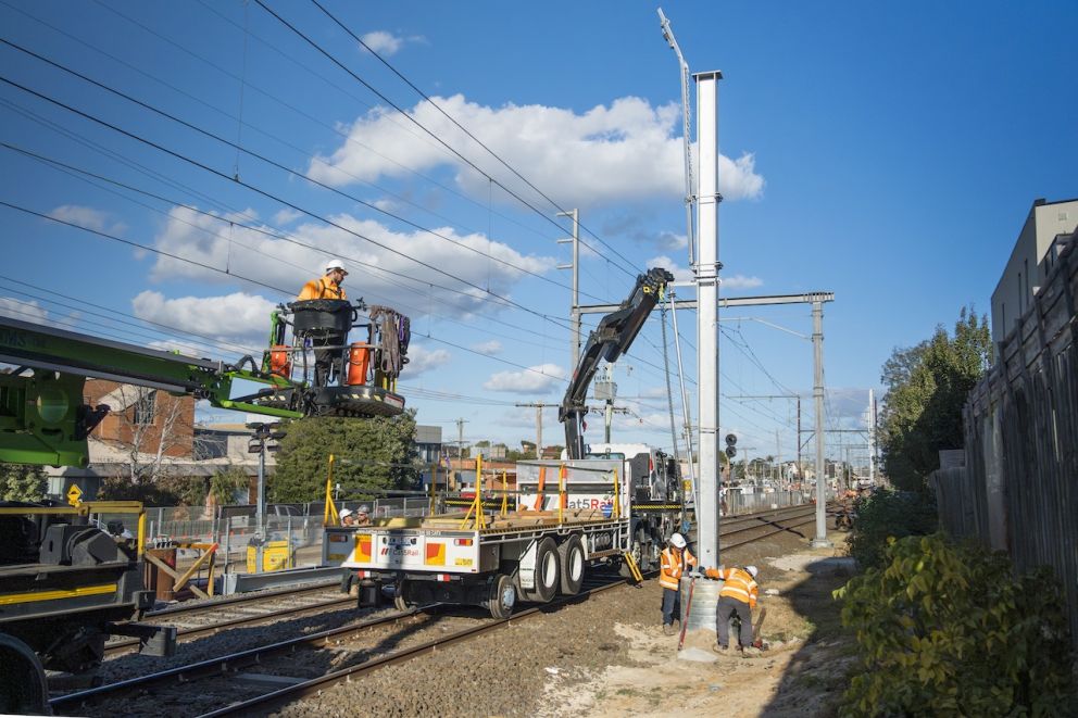 Crews work on the installation of overhead power poles near Albert Street, Mordialloc