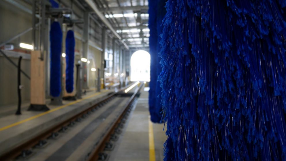 Inside the train wash where the trains are scrubbed clean by big brushes