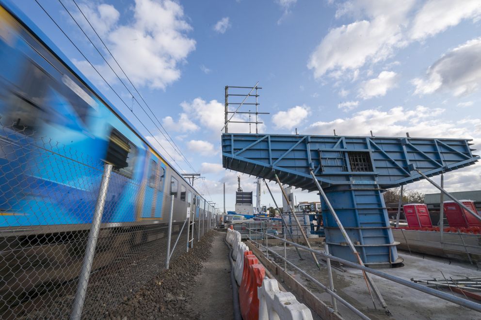 Station Street, Aspendale works progressing alongside active rail operations, with the formwork of pier and crossheads installed