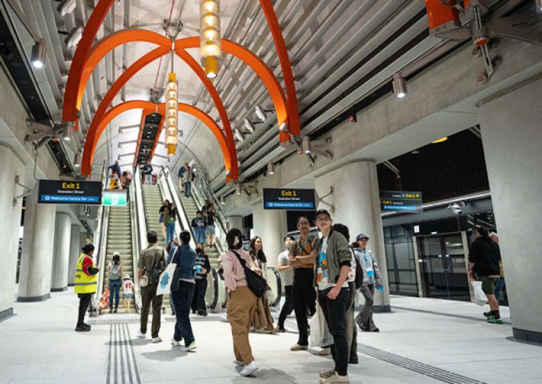 People exploring State Library Station