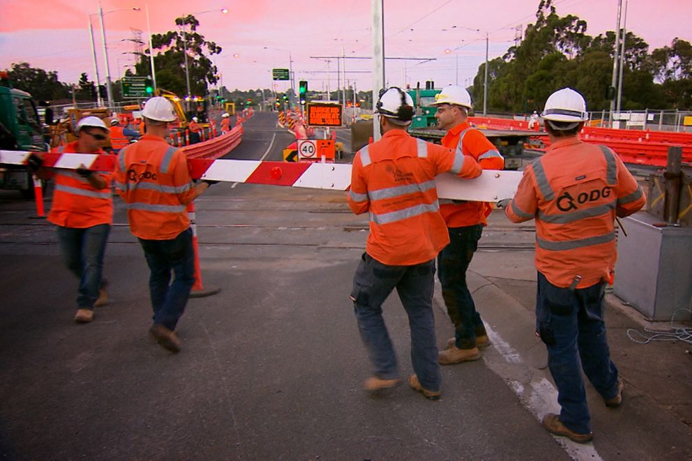 Workers removing the boom gates at Burke Road, Glen Iris in January 2016
