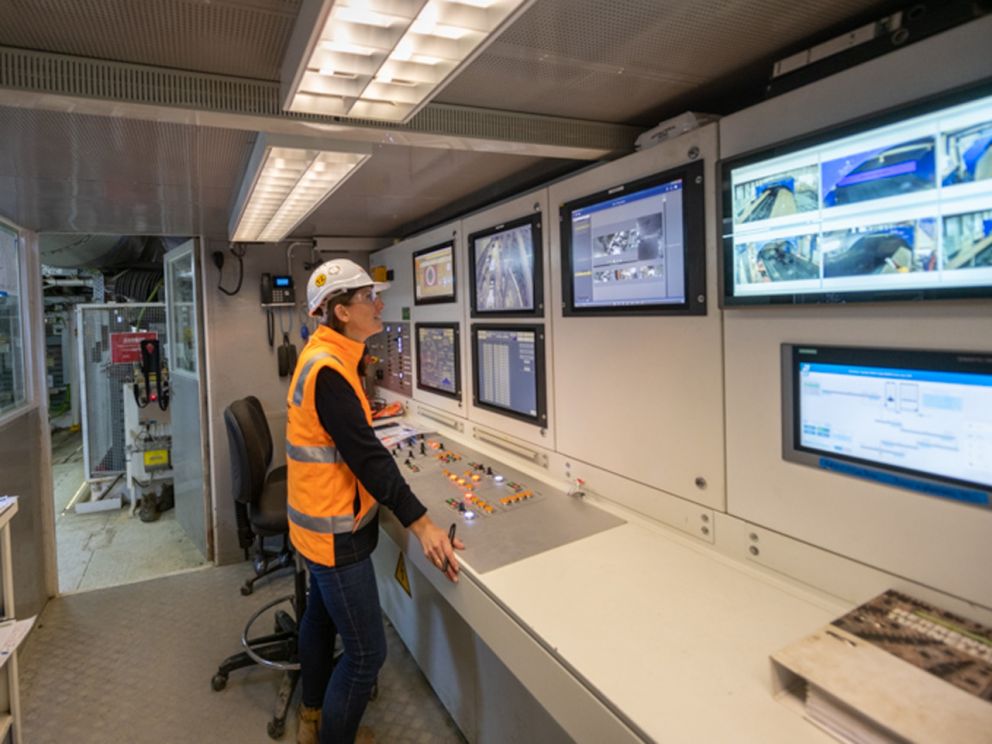 Vida starts her journey - a worker monitoring the TBM via the control panel.