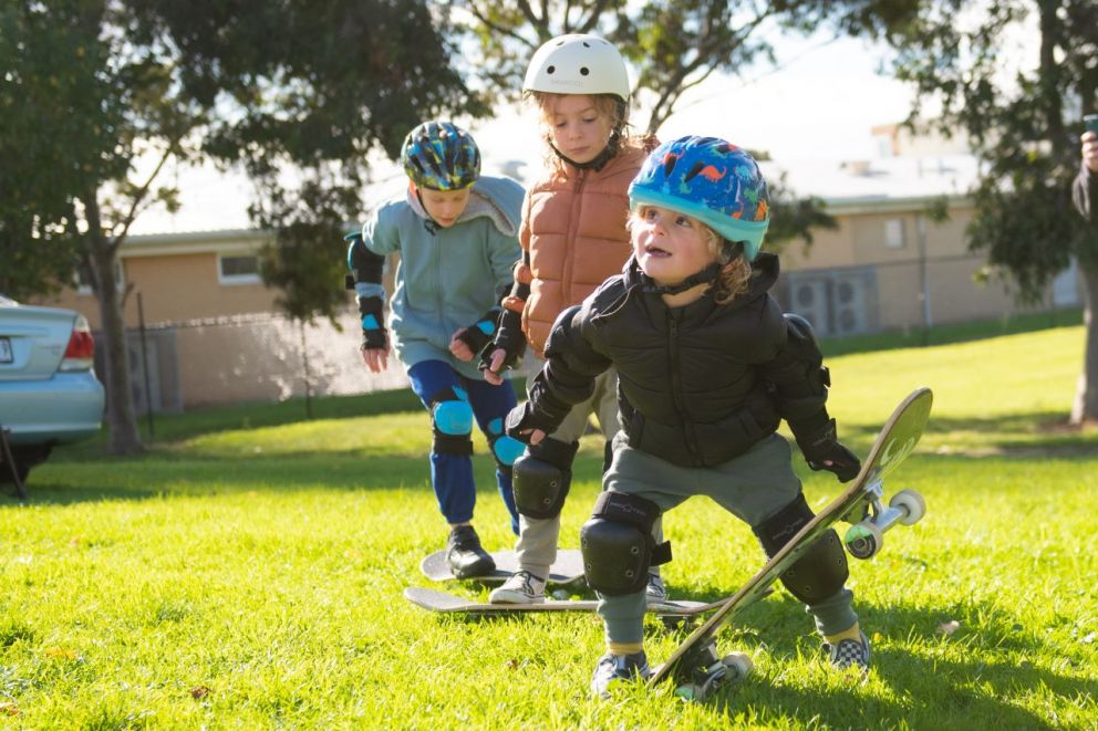 A child experiences a ride on a skateboard.