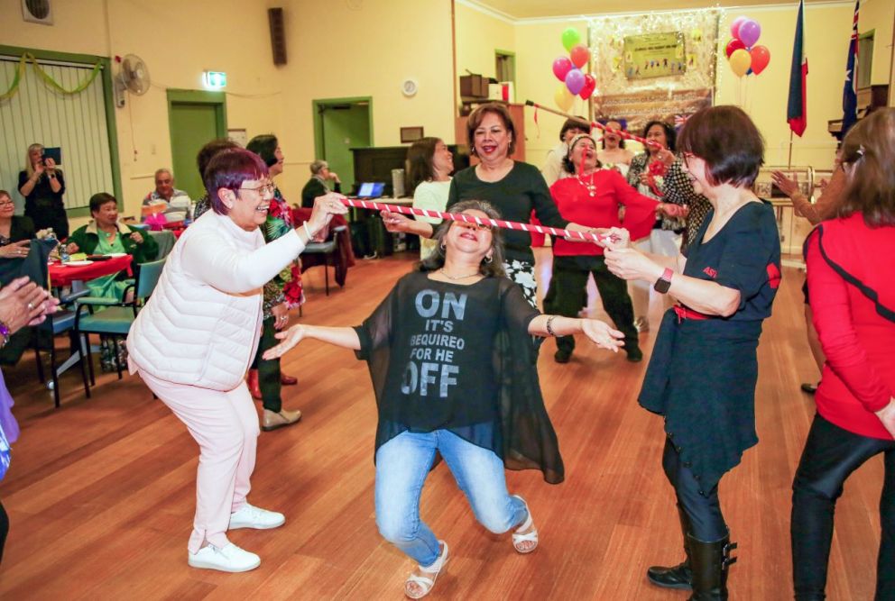 Doing the Limbo Rock at Dance the Night Away - Annual Senior Filipino Festivity