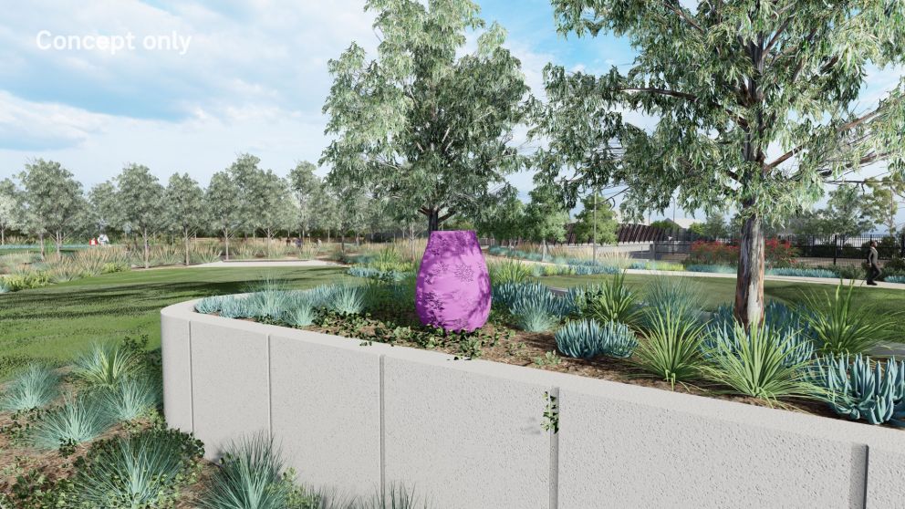 A purple sculpture in a park with flower detailing.