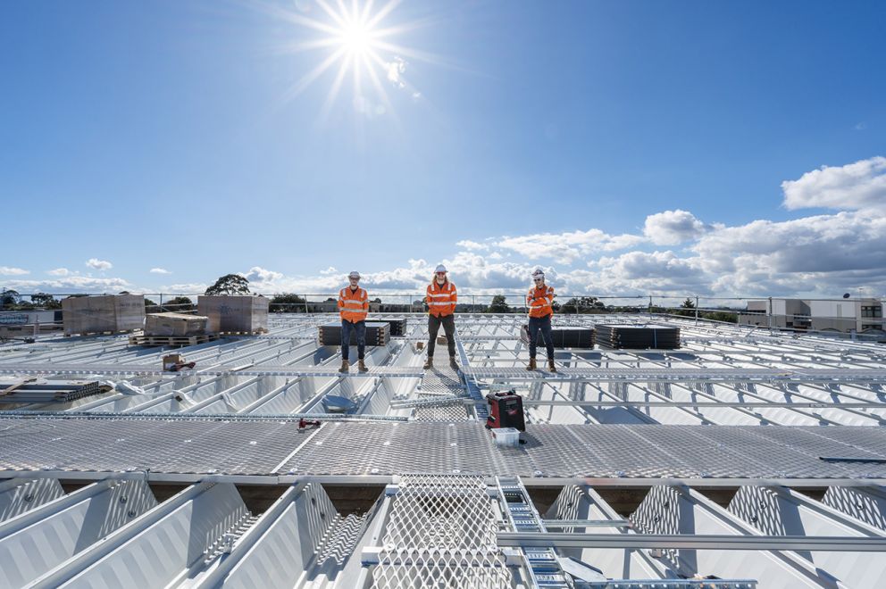 Laying solar panels at the new Glen Huntly Station