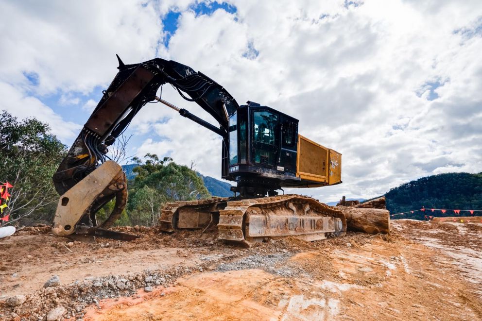 Excavator parked at the top of the landslip