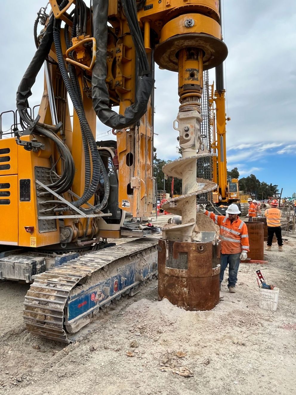Workers piling the foundations
