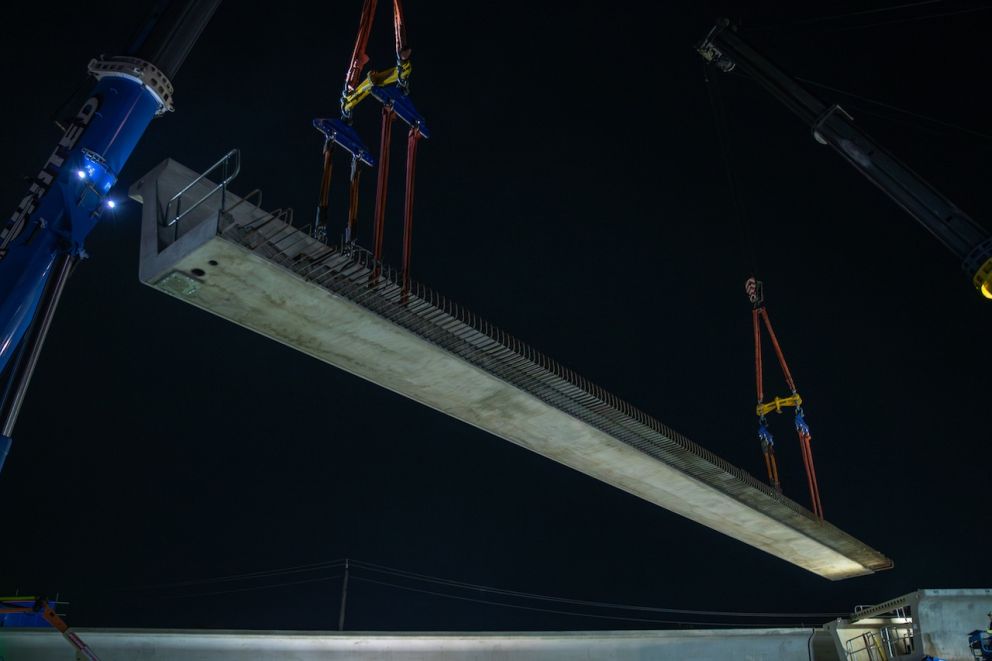 Two cranes were used to lift and position the beams into place