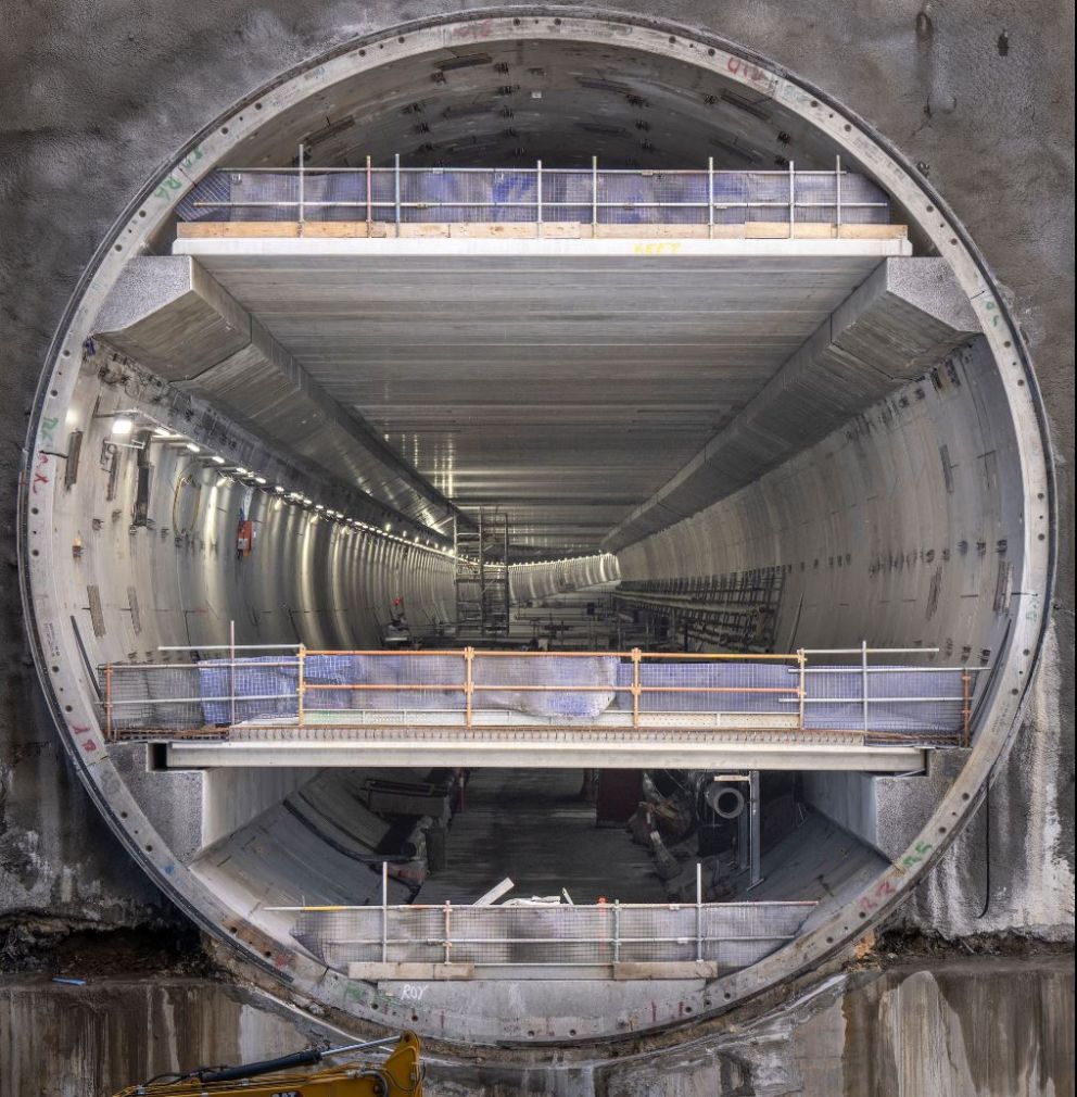 There are 3 levels inside the tunnels - completed ventilation, road and maintenance decks. Crews are now busy building the safety cross passages, building the tunnel entrances, exits, and installing safety and other electrical systems.