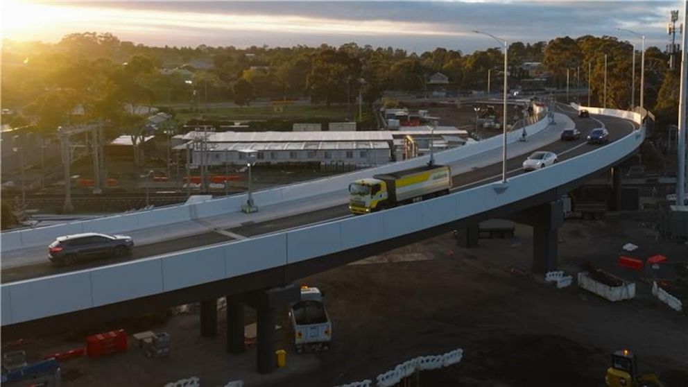 Vehicles travel over the new Golden Way bridge
