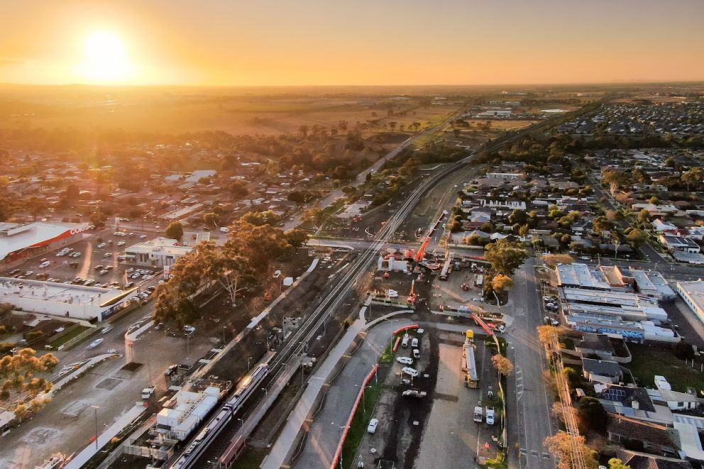 Sun beams onto Melton as crews get ready to lift the first L-beam into place