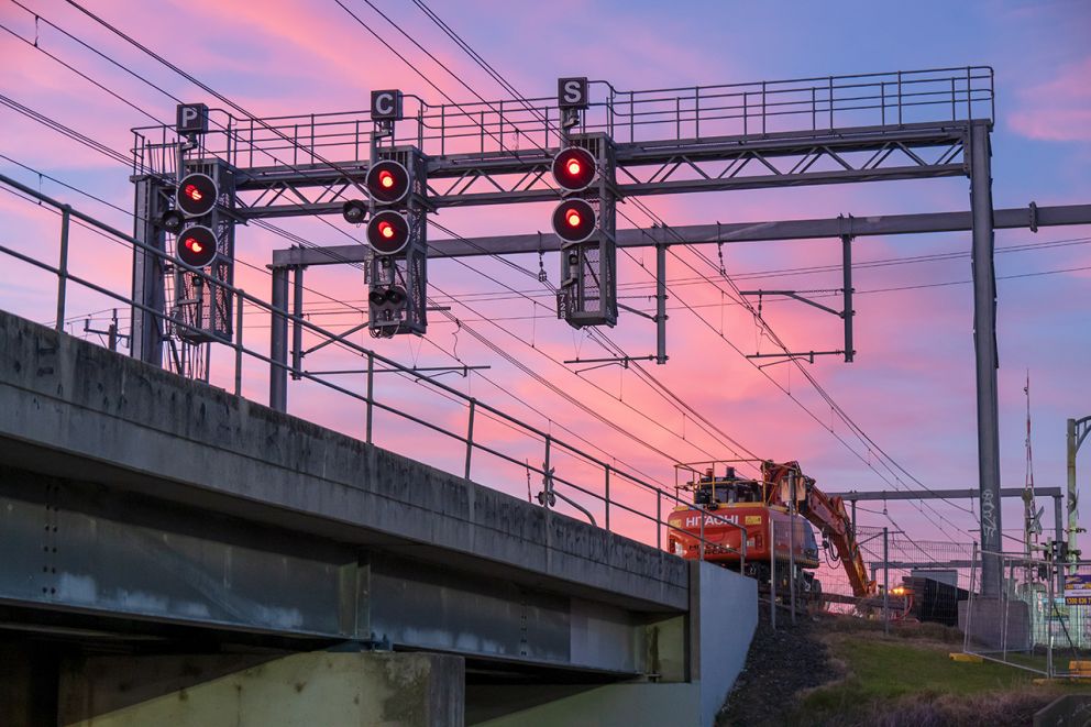 High-rail works on the tracks in the early morning under overheads above the rail bridge at Dandenong Creek