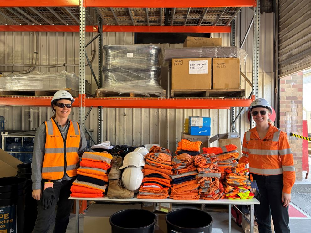 Image shows group of SRL employees in recycled protective equipment