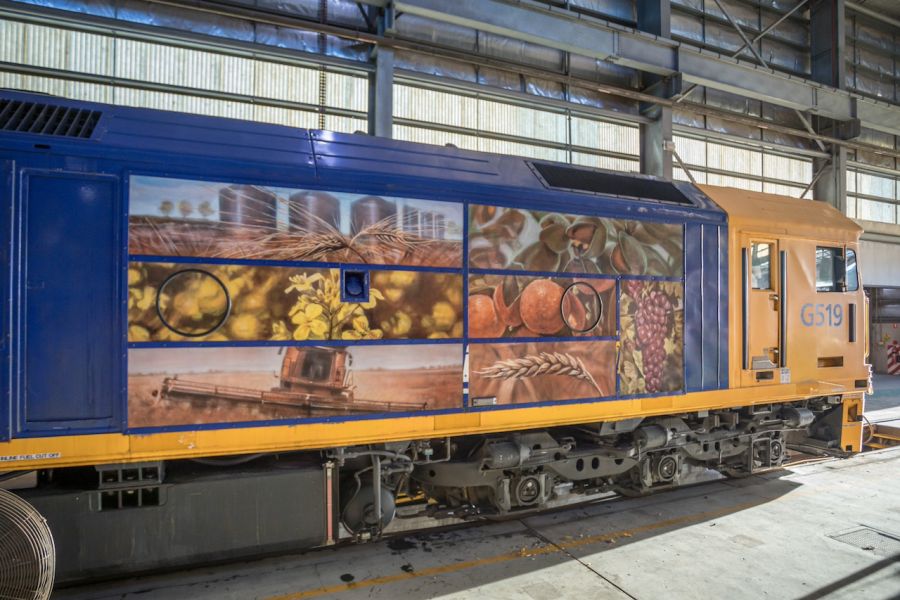 Paintings of local produce an a freight train